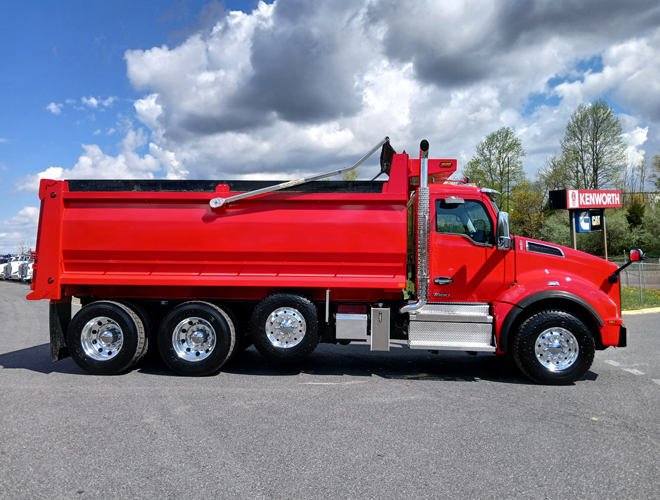 Red Kenworth T880 dump truck after repaint